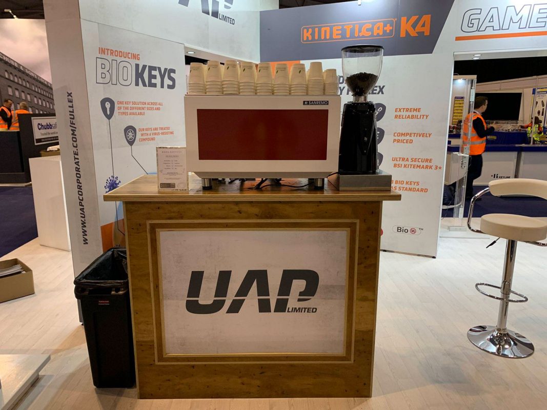 exhibition coffee stand branding at event to attract customers over to talk 2022